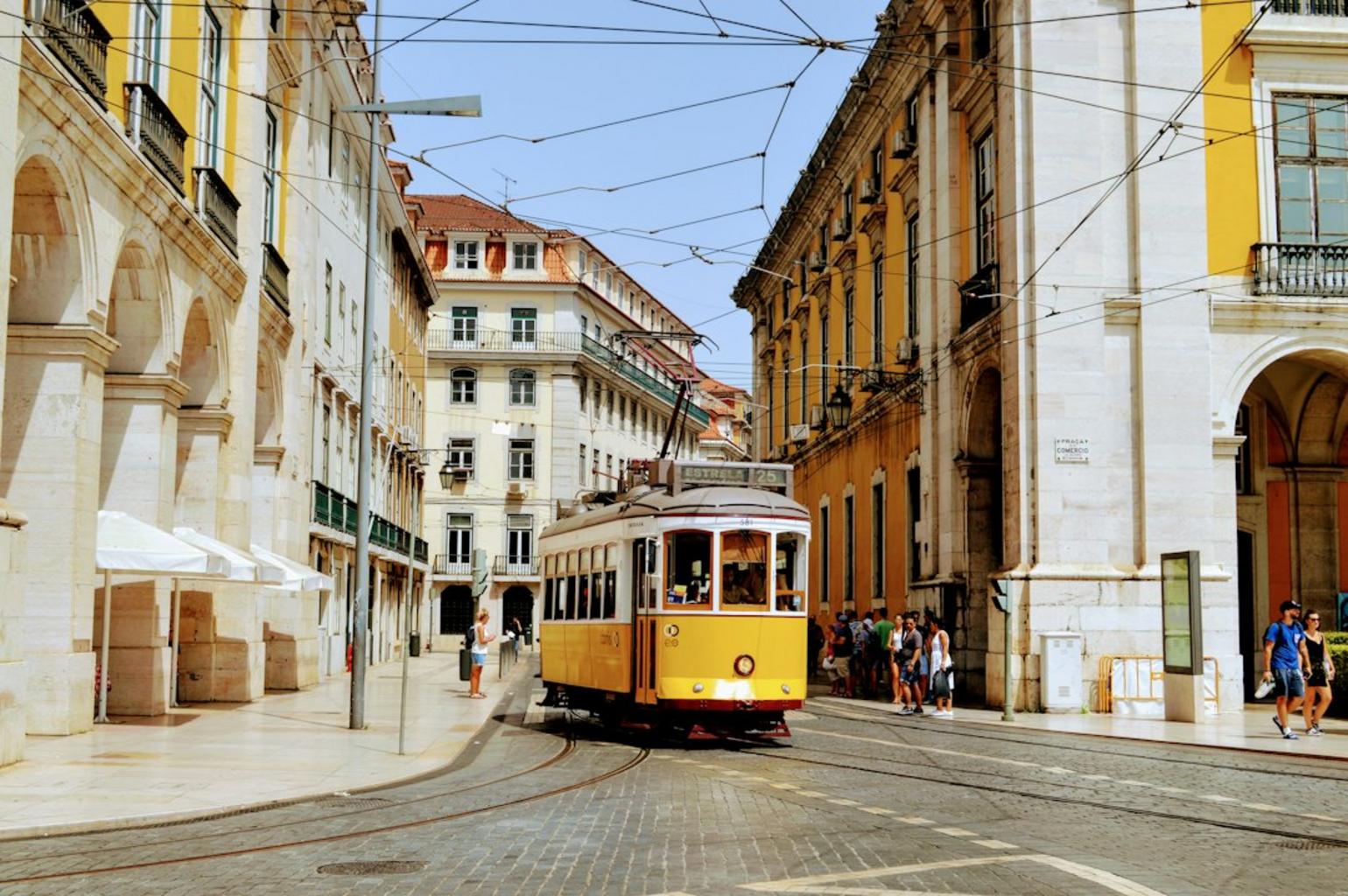 Lisbon tram and crowd illustrating pickpocketing risks