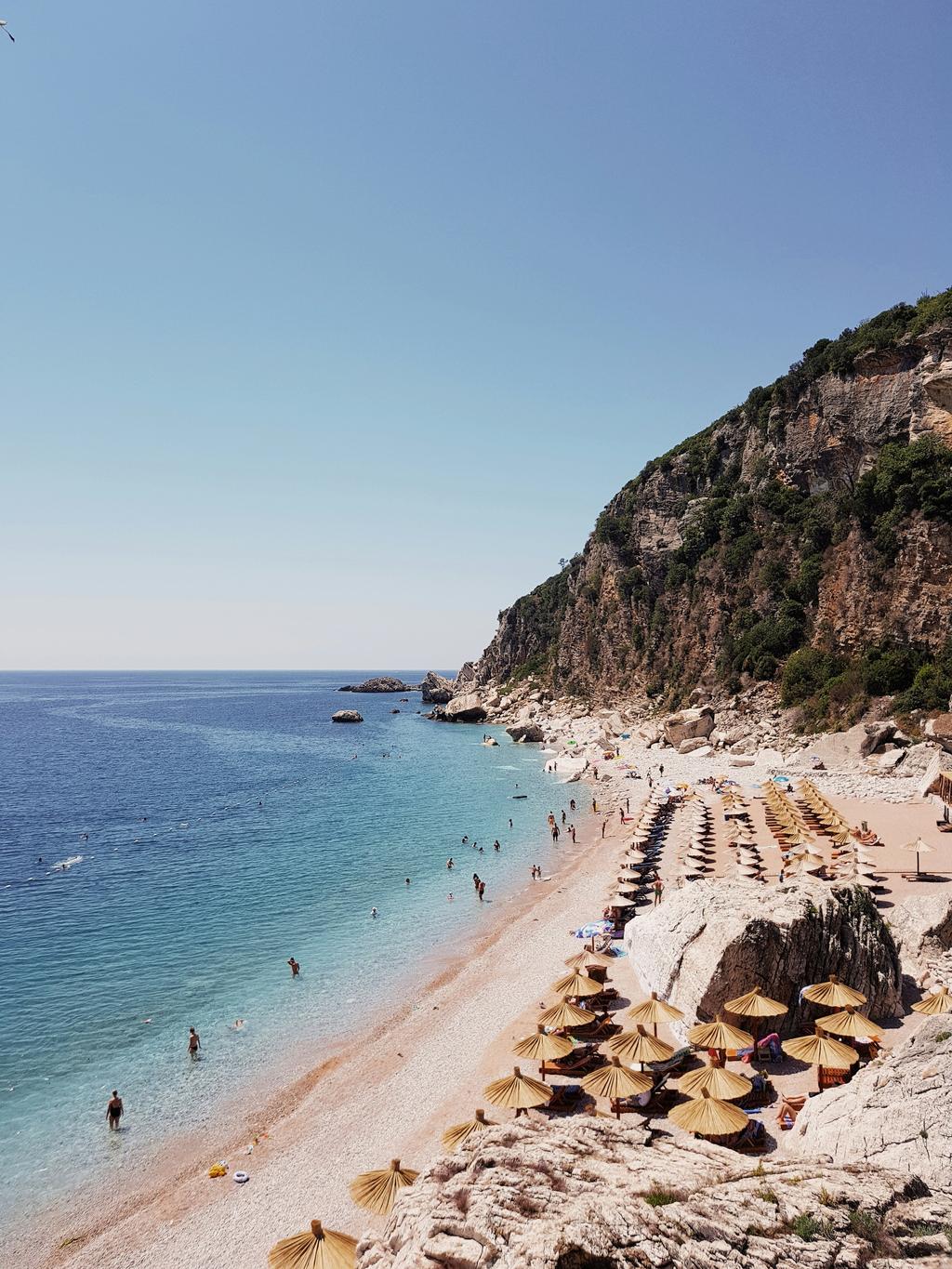 Pebbled beach with mountain views in Montenegro