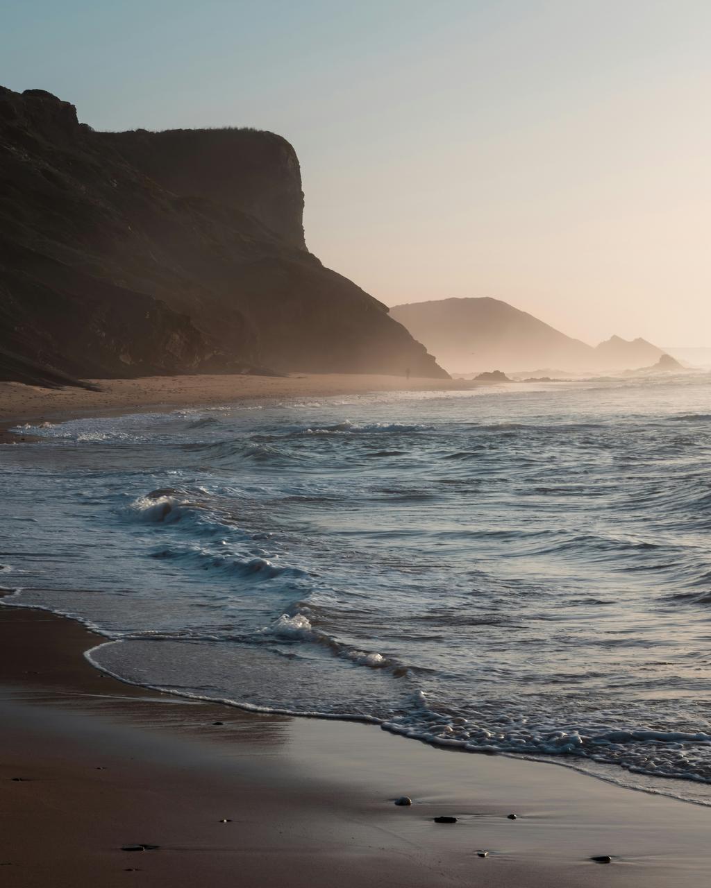 East Coast hidden beach with dunes and parking area